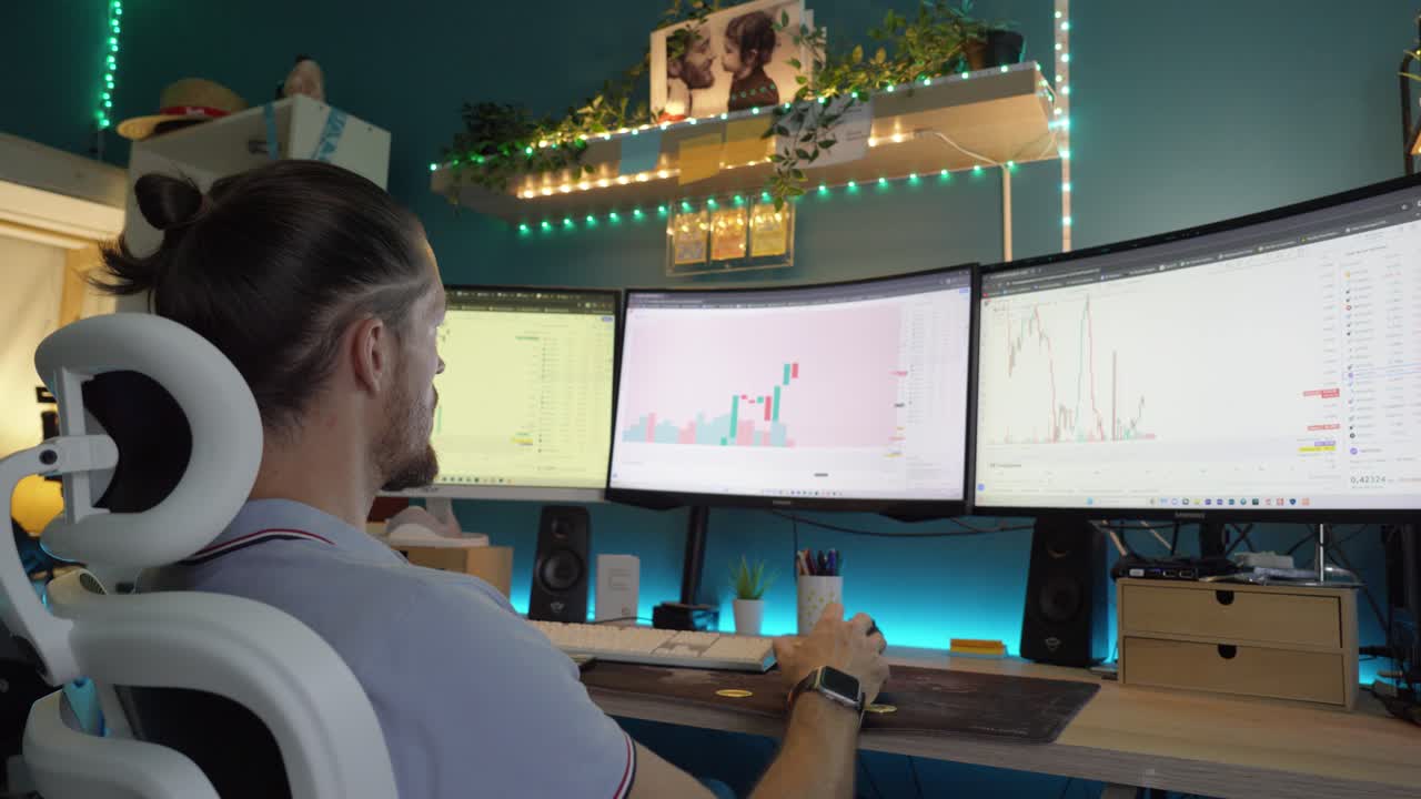 close-up shot of a man sitting and looking at crypto graphs realising his losses