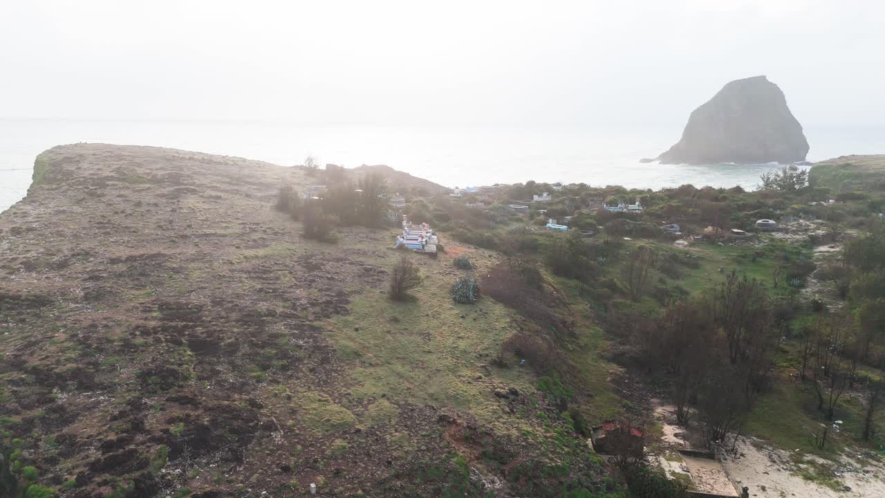 Aerial View Orbit of the Village on the Mountain in Bãi TắM Hòn Choi in the Morning.