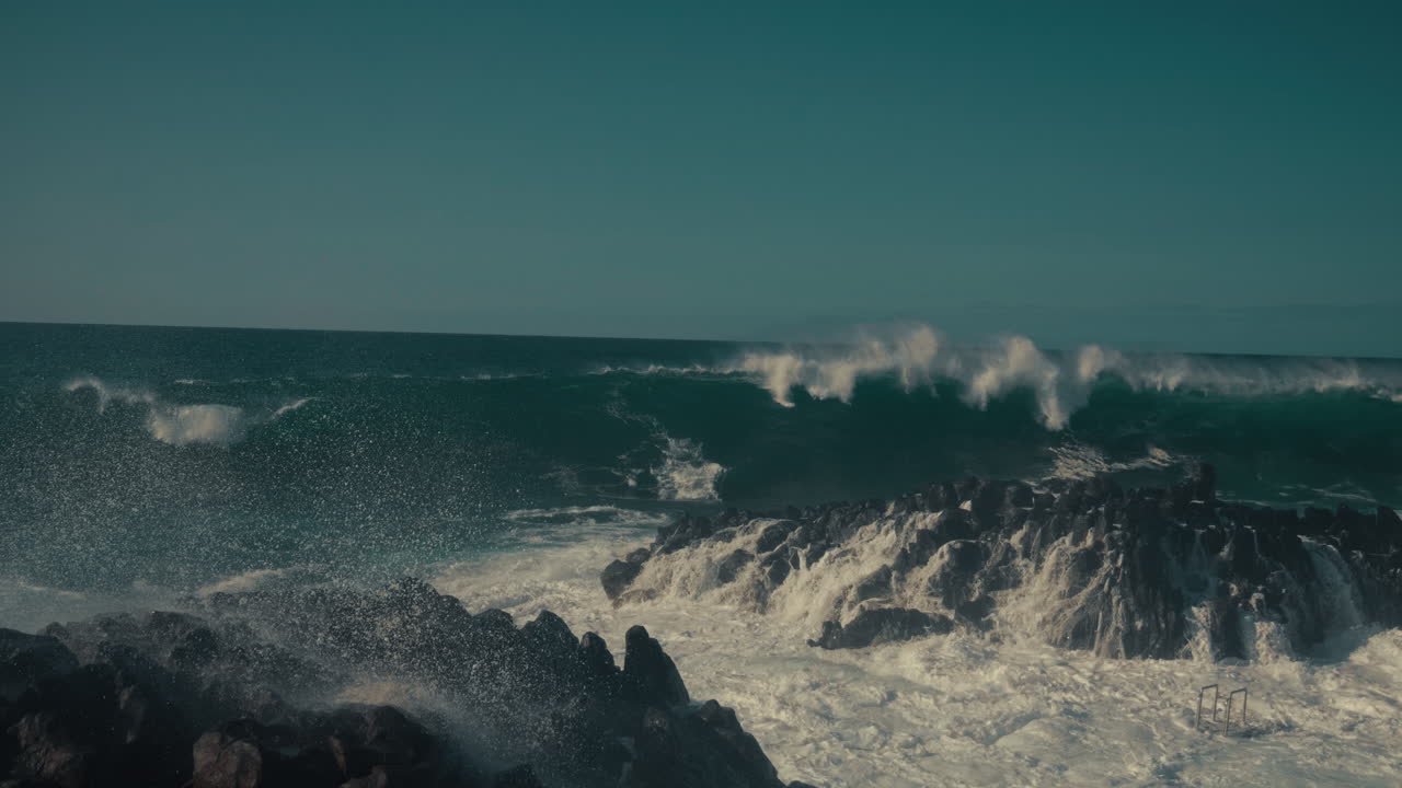Powerful Waves Crashing on Rocky Coastline