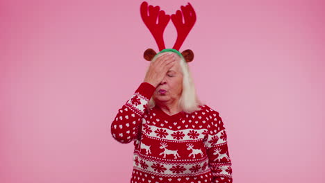 Upset-senior-Christmas-old-woman-making-face-palm-gesture,-feeling-bored,-disappointed,-bad-result