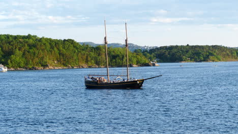 touristic sailboat cruising in oslo fjord on a sunny day