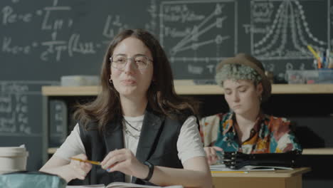 students in a classroom with a chalkboard