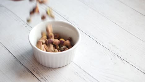 close up of pistachios nut on hand