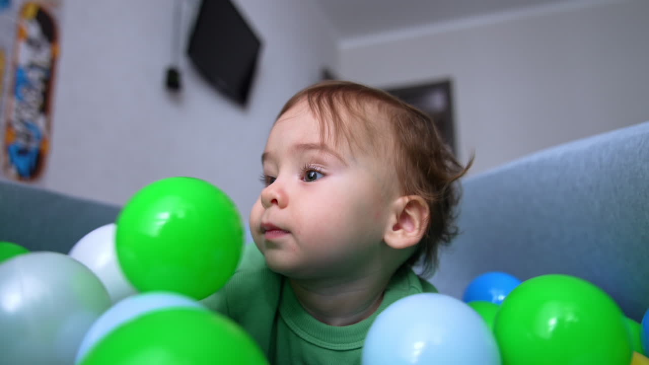 Baby Playing in a Ball Pit