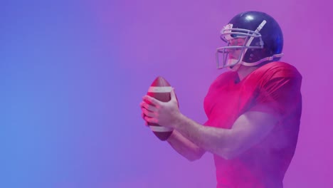 Video-of-caucasian-american-football-player-in-helmet-with-ball-over-neon-purple-background