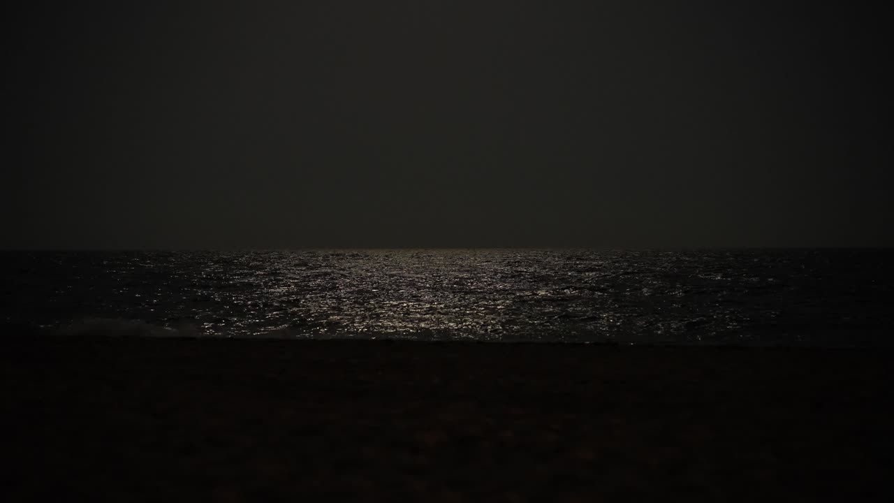 moon light reflection on sea shallow surface persian gulf at night hazy landscape in Iran sea the night wide view landscape of black background tropical nature of qatar uae dubai destination in iran