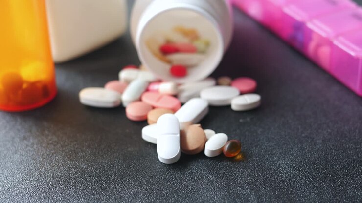 Selective focus close up of many ful pills and capsules