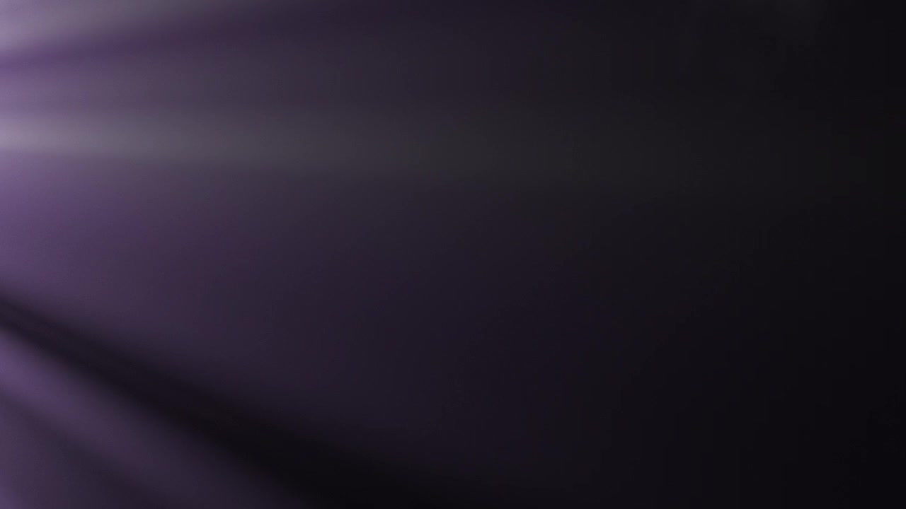Light Rays Moving Across Dark Background