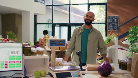 Salesperson-in-eco-store-weighs-produce