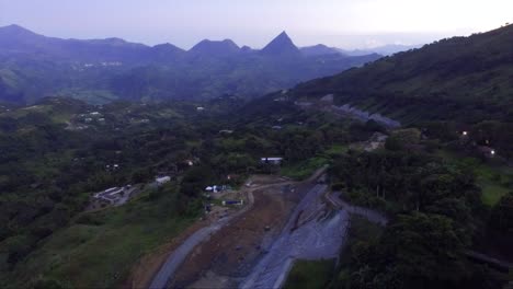 aerial view of road construction in mountainous landscape