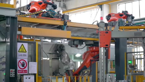 Massive-factory-of-heavy-equipment-Automobile-plant,-modern-production-of-cars,-car-body-assembly-process,-automated-production-line