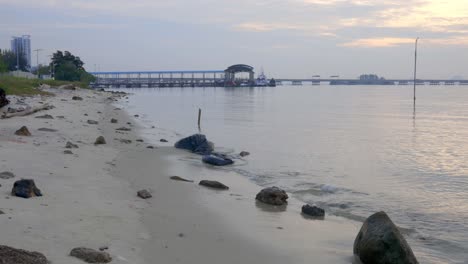 Beach-and-marina-looking-over-the-Penang-Bridge-on-the-edge-of-Georgetown,-Malaysia