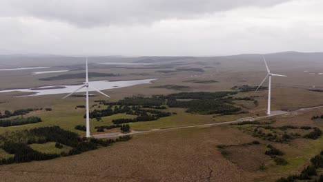 drone shot of moorland wind turbines on the western isles of scotland