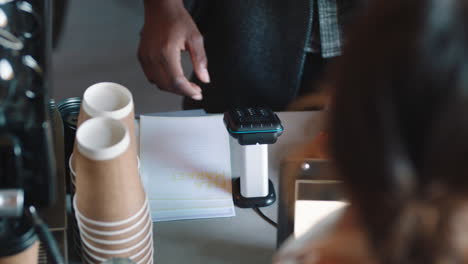 businesman customer using smart watch making contactless payment mobile money transfer in cafe enjoying service in restaurant