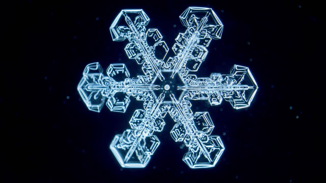 Blue snowflake ice crystal under microscope darkfield