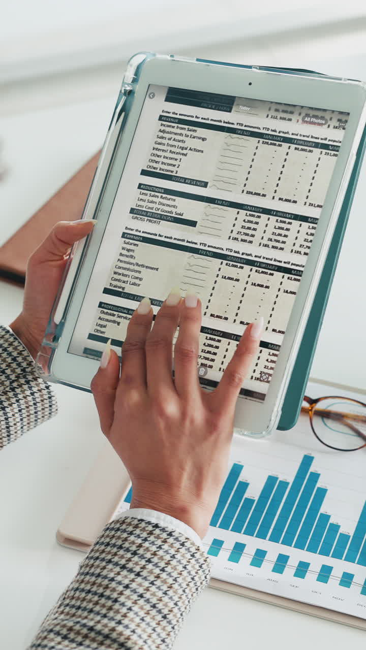 Professional Hands Scrolling Financial Report on Digital Tablet