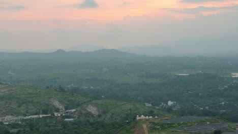 scenic aerial view of mountains with dramatic sunset cloudy evening sky