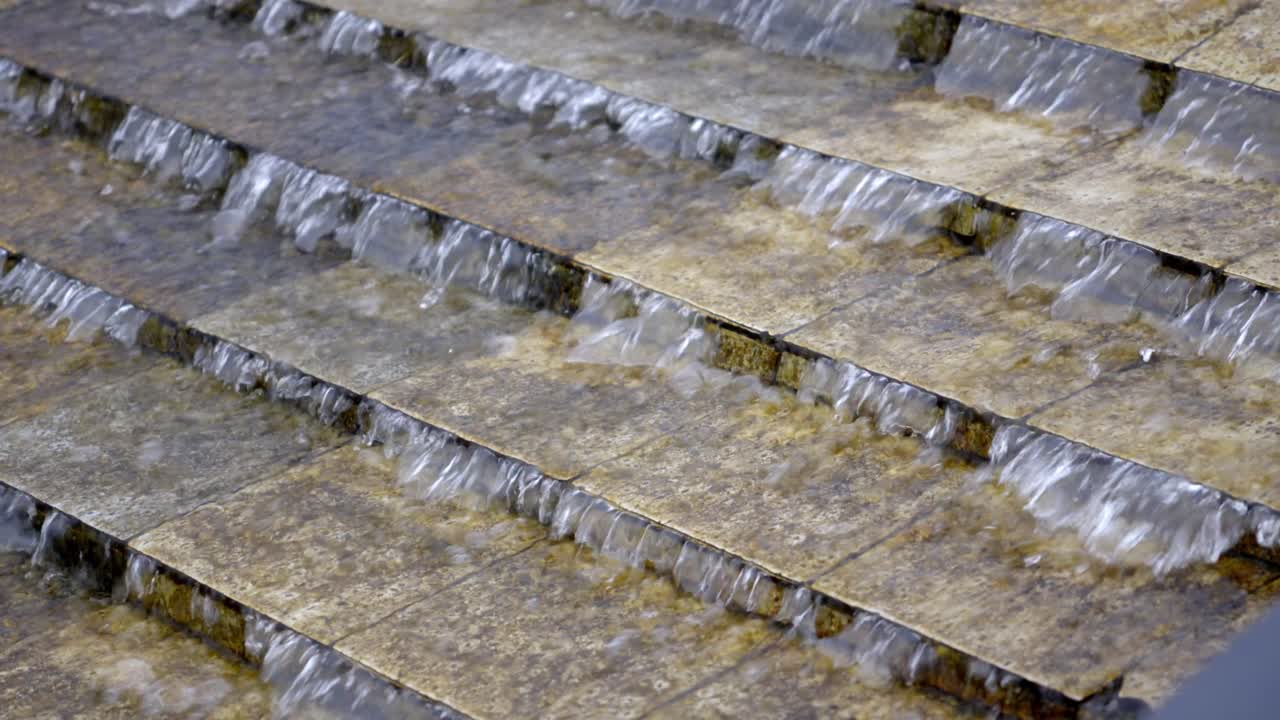Water cascade, water flowing through steps in garden,step falls