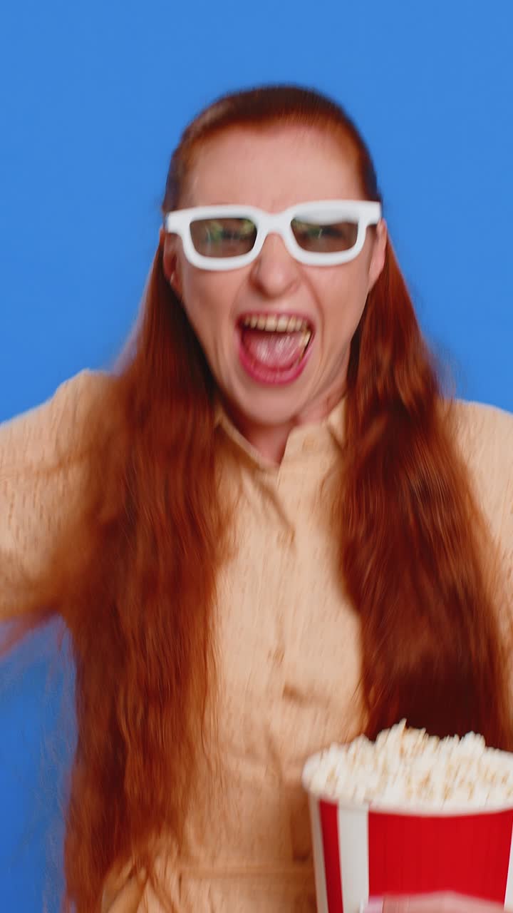 Adult woman in 3d glasses eating popcorn watching tv serial sport game film online movie content