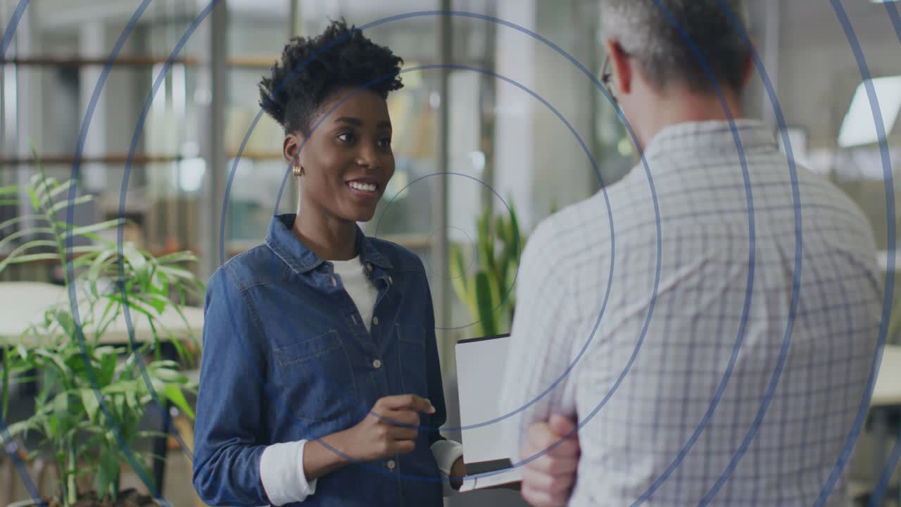 Employee tapping laptop keyboard and initiating animated chart overlay for presenting sales data