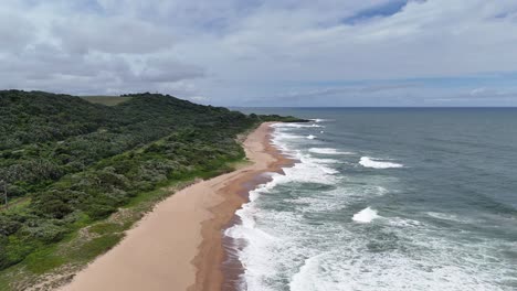 Aerial-of-the-famous-diver's-paradise-Aliwal-Shoal-Coral-Reef-Beach-near-Scottburgh,-South-Africa