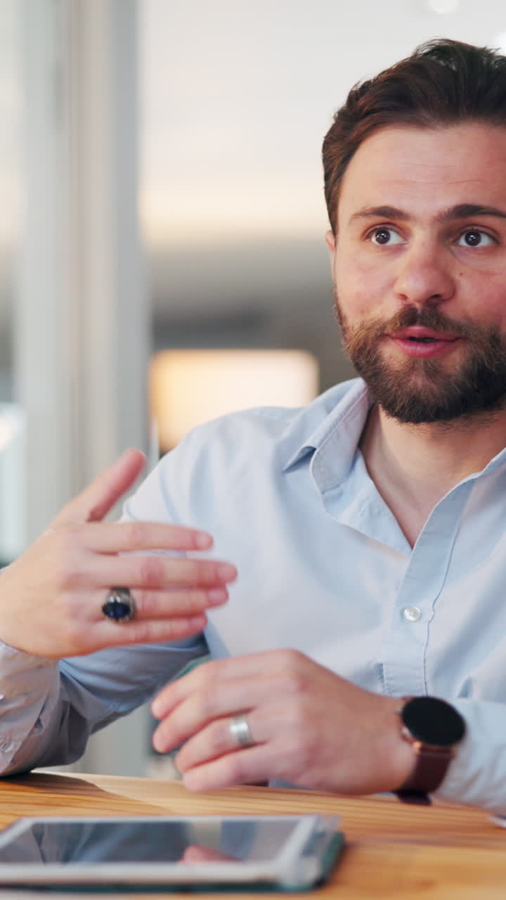 Professional Man Talking and Gesturing During a Business Meeting