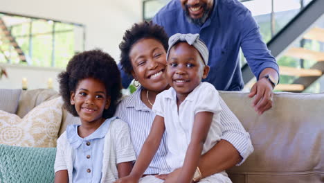 happy family, home and hug on couch