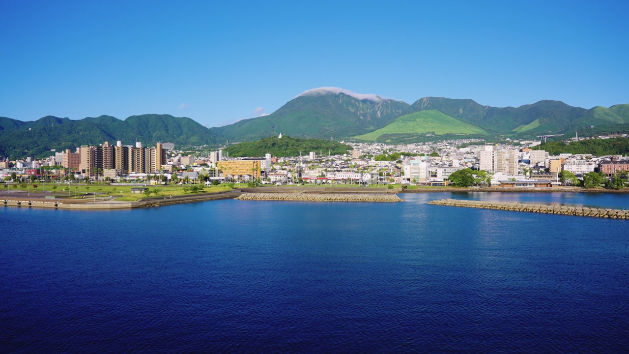 Beppu City and Mountains, Establishing Shot in Morning Arriving From Ocean