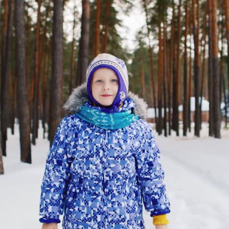 Excited-Young-Girl-In-A-Snowy-Forest-Scene