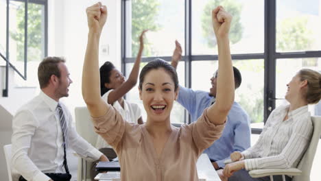 close up on businesswoman raising arms for success