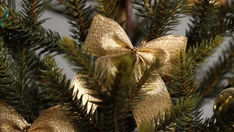 gold bow tie on christmas tree