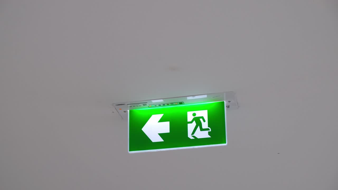 Exit Sign attached to the ceiling, Bangkok, Thailand