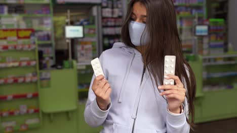 teenager in pharmacy comparing medications