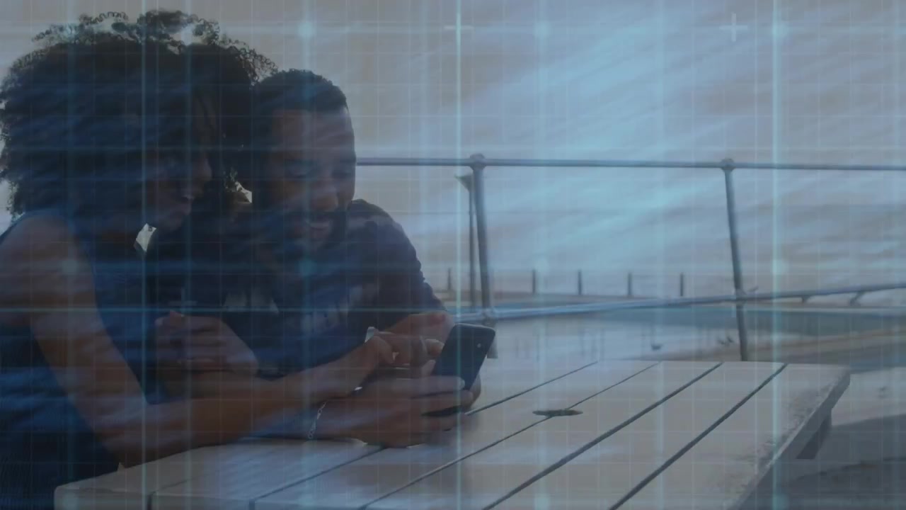 Couple tapping smartphone waterside patio and pointing item while exploring tech code overlay