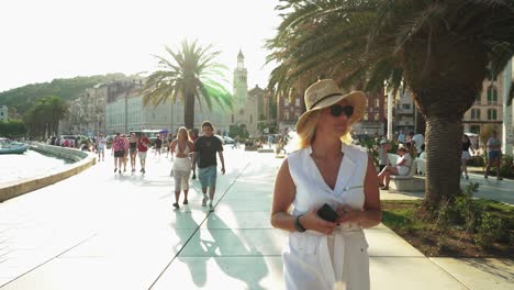 split croatia 30.07.2024 old town city center during the day. beautiful women tourist exploring the ancient game of thrones filming locations.