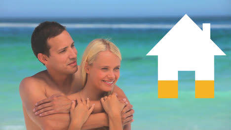 una pareja de vacaciones se abraza junto al mar mientras el icono de la casa se llena de amarillo.