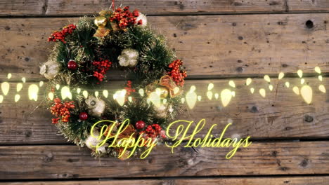 animation of happy holidays text over wreath on wooden background