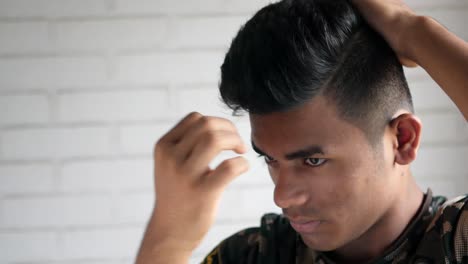 young man styling his hair