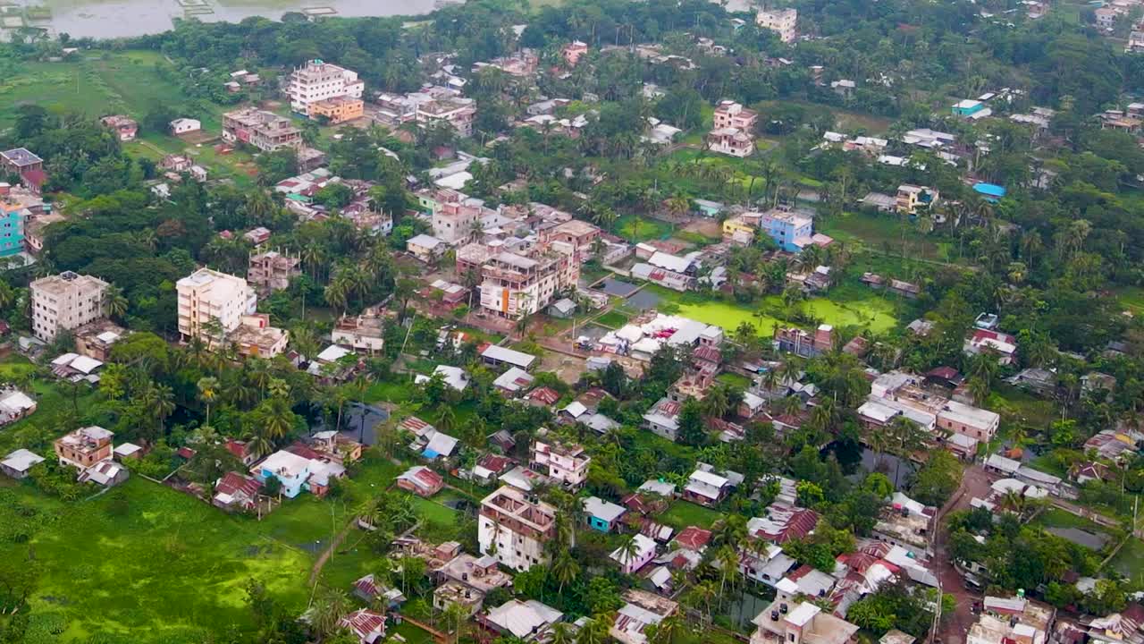 Bangladesh suburban village with colorful buildings, poor third world country