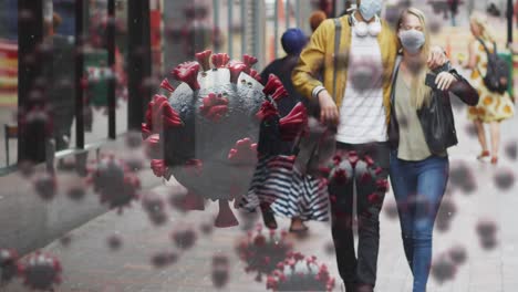 animation of virus cells over caucasian couple wearing face mask