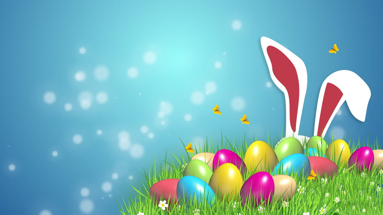 Festive animation with Easter colored eggs on green grass and rabbit ears. Abstract blue background with blurred particles. Looped video.