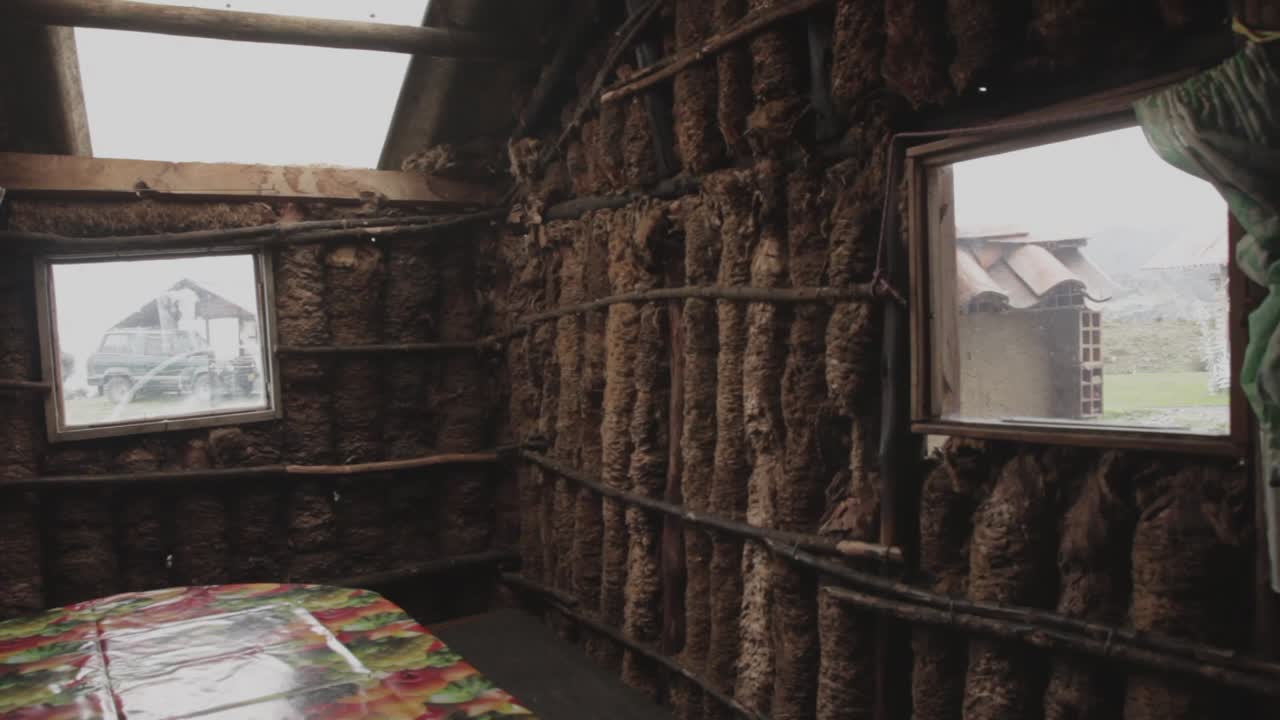 Tilt down inside a house made of frailejón trunks in the Cocuy mountain range, Colombia