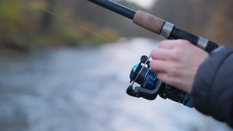 a man is fishing in a mountain river in the usa fishing is a hobby a man is fishing in a mountain river in the usa fishing is a hobby