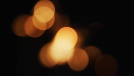 Out-of-focus-party-sparkler-sparkling-on-black-background