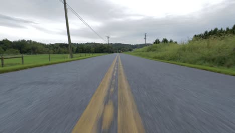 4k close-up camera truck out of a rural road in eastern pennsylvania.