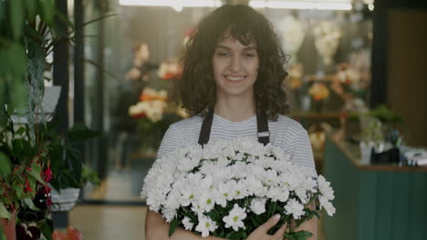 woman florist holding a bouquet of flowers