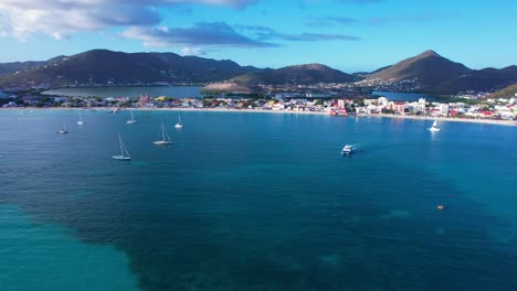 Aerial-of-Great-Bay-Beach-in-Philipsburg,-Sint-Maarten-during-calm-sunset