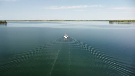 Aerial-Sailboat-Follow-Pan,-Les-Cheneaux-Islands,-Hessel,-Michigan