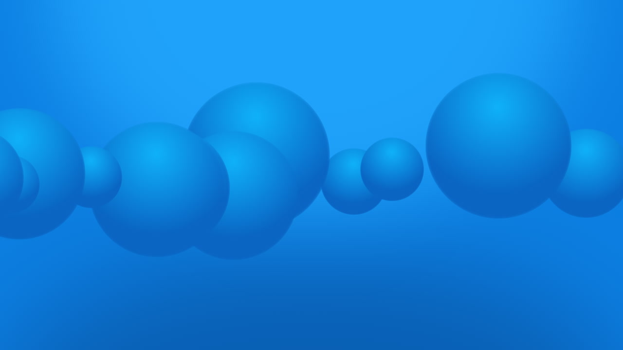 Animation of variable size large blue spheres animation moving across the view from left to right on a gradient background