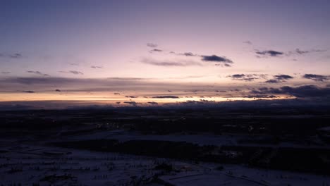 High-contrast-Golden-Hour-drone-shot-of-the-win-ter-community-and-sky